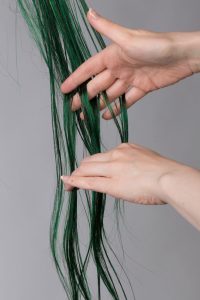 detangling a wig with fingers