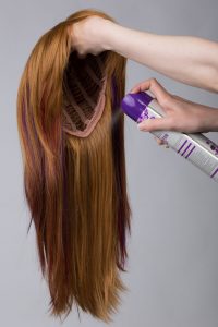 wig with hairspray can