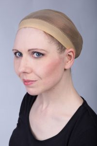 putting on a wig cap