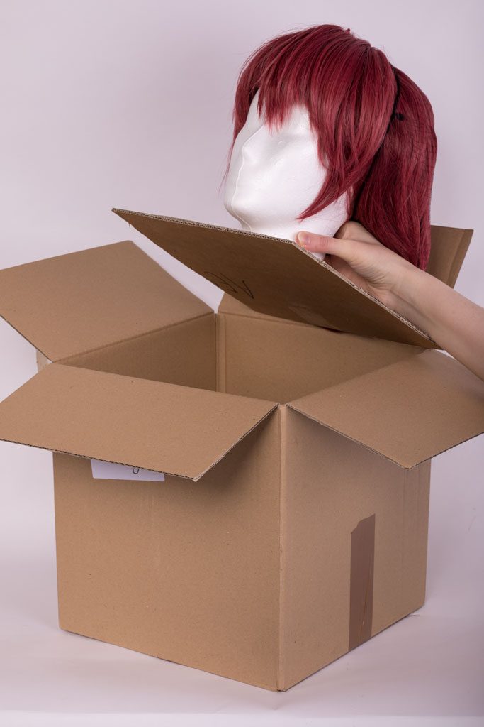 put the wig head in the box