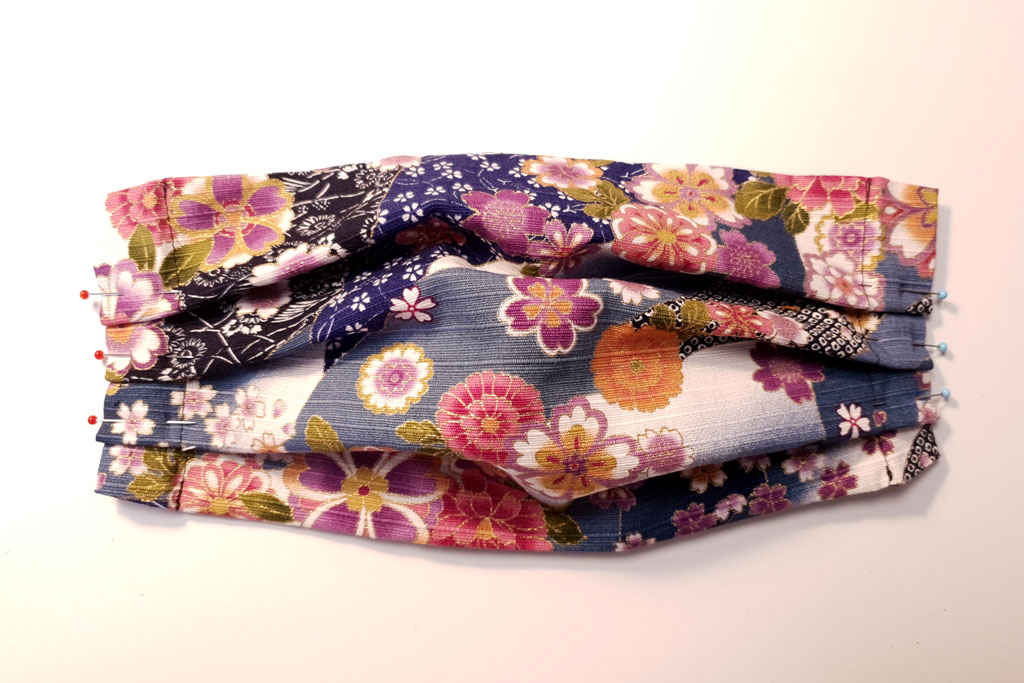 mask with pinned pleats