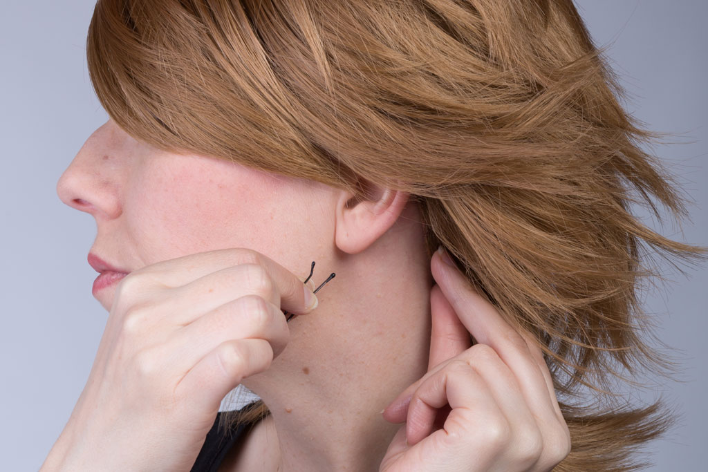 hand with bobby pin