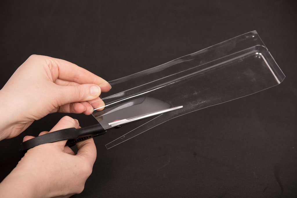 cutting a plastic blister pack