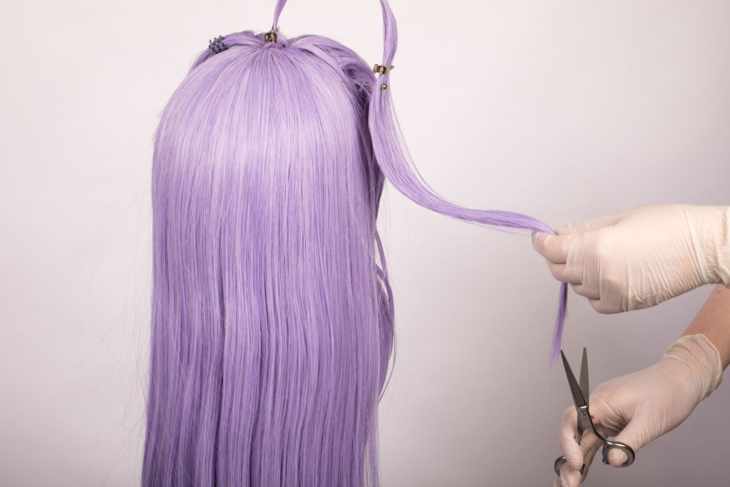 scissors cutting the tips on a wig
